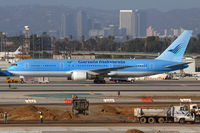 G-OBYE @ LAX - Garuda Indonesia G-OBYE taxiing to the remote terminals at the west end of the airport. - by Dean Heald