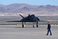 80-0787 @ KLSV - Lockheed / USAF / F-117A Nighthawk (cn A.4012) / Aviation Nation 2006 - Thunderbird crewmember in foreground. - by Brad Campbell