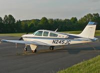 N245JC @ CDW - Well-dressed Bonanza soaks in a sultry summer evening at Caldwell. - by Daniel L. Berek