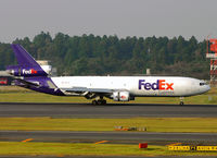 N574FE @ RJAA - MD-11 - by mark a. camenzuli