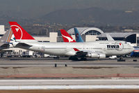 N662US @ LAX - Lots of tails here!  Northwest Airlines N662US (FLT NWA1), destined for Narita Int'l (RJAA), taxiing to RWY 25R. - by Dean Heald