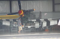 N451MG @ YIP - Jack Roush's Old Crow P-51 in hangar getting worked on