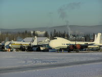 N898AT @ PAFA - Cargo ramp at Fairbanks; Looks a DC-6/7 highly modified forward of the wing. - by John J. Boling