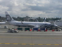 N552AS @ KSEA - Alaska B-737 at gate Seatac - by John J. Boling