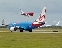 VH-VBY @ YBBN - VB's 50th a/c and with a standard Virgin Blue landing on 19 - by DaveWilson