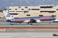 N604AA @ LAX - American Airlines N604AA (FLT AAL1593) from Fort Lauderdale Hollywood Int'l (KFLL) touching down on RWY 7L in very windy conditions. - by Dean Heald