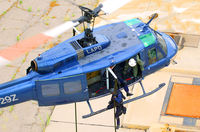 N5929Z - Bell UH-1H Huey Fast Rope SWAT Engaging - by Glenn Grossman
