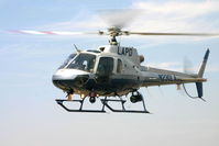 N230LA - Eurocopter AS 350 B2 Preparing To Land - by Glenn Grossman