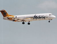 N107ML @ MIA - Midway Fokker 100 landing on Runway 9