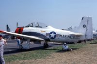 N912KK @ OSH - T-28C 146253, ex-N912KK and N311LK - by Glenn E. Chatfield