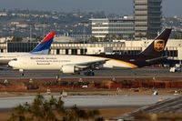 N320UP @ LAX - UPS N320UP (FLT UPS2920) exitting RWY 25R after arrival from Louisville Int'l Standiford Field (KSDF) - by Dean Heald