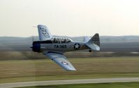 N496DK @ DPA - T-6G 49-3365 flying by the control tower - by Glenn E. Chatfield
