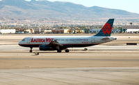 N657AW @ LAS - America West flight taxi to take-off - by John Little