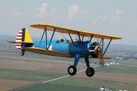 N1714M @ GBG - Stearman in Flight at National Steraman Fly-In - by Bob Jesko