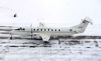 86-0080 @ CID - C-12J taxiing by the control tower - by Glenn E. Chatfield