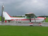 G-BRZS @ EGBK - Cessna 172 on a very wet day at Sywell - by Simon Palmer