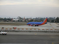 N527SW @ LAX - Southwest 737-5H4 in new colors taxying out @ LAX - by Steve Nation