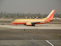 N731SA @ LAX - Southwest 737-7H4 in old colors and winglets taxying to active runway @ LAX - by Steve Nation