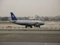 N813UA @ LAX - United A319-131 in old colors turning on to active runway @ LAX - by Steve Nation