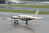 N802MM @ PDK - At Epps Air Service In The Rain - by Michael Martin