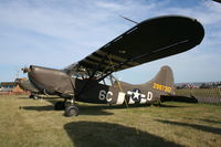 N2561C @ KOSH - Stinson L-5E - by Mark Pasqualino