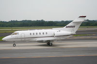N886QS @ PDK - Taxing to Signature Flight Services - by Michael Martin