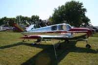 N5186C @ KOSH - Beech B35 - by Mark Pasqualino