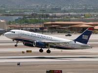 N814AW @ PHX - Airborne from 07L - by John Meneely