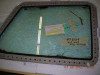 N619UA @ CYUL - Captains windshield after removal - by John J. Boling