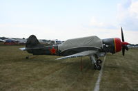 N524JS @ KOSH - YAK-52TW - by Mark Pasqualino