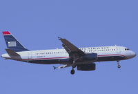 N658AW @ SNA - US Airways A320-232 coming in for landing - by Mike Khansa