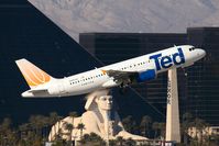 N497UA @ LAS - United Airlines (Ted) N497UA (FLT UAL1476) climbing out from RWY 01R, with the Luxor Resort & Casino in the background. - by Dean Heald