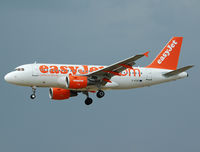 G-EZIO @ LEBL - Short final RWY 25R. - by Jorge Molina