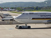 9V-SMN @ LSZH - towing the a/c to the gate - by eap_spotter