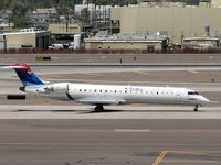 N340CA @ PHX - Lunchtime departure for one of Skywest's CRJs - by John Meneely