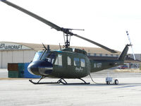 N1577 @ KFTW - Dyncorp UH-1 ready for flight.