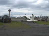N2975C @ Z41 - 1954 Cessna 180 SKYWAGON, Continental O-470 230 Hp upgrade, ANC Tower in background - by Doug Robertson