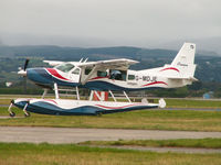 G-MDJE @ EGPF - Cessna 208/Loch Lomond Seaplanes/Glasgow - by Ian Woodcock