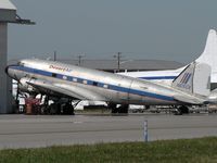 N105CA @ LCK - Desert Air DC-3 parked with some Air Tahoma Convairs - by John Meneely