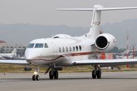 N110ED @ VNY - Candybar Aviation LLC's 2006 Gulfstream G-V-SP (G500) N110ED taxiing to RWY 16R for departure. - by Dean Heald