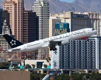 N936UW @ LAS - US Airways Star Alliance scheme N936UW (FLT USA730) climbing out from RWY 1R enroute to Philadelphia Int'L (KPHL). - by Dean Heald