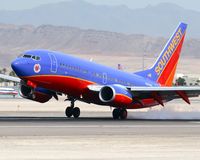 N215WN @ LAS - Southwest Airlines Ron Chapman - LUV IS ON THE AIR N215WN landing on RWY 25L. - by Dean Heald