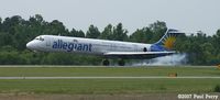 N876GA @ ISO - Allegiant Air smoking the tires - by Paul Perry