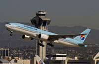 HL7531 @ KLAX - climbing from rwy 25R in front the well known tower. - by Philippe Bleus