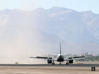 UNKNOWN @ KLAS - US Airways landing in the dust cloud of G-VROY. - by Brad Campbell