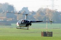 G-BXUC @ EGBJ - R22 Beta at Gloucestershire (Staverton) Airport - by Terry Fletcher