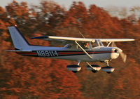 N89114 @ 47N - A nice Cessna 152 gently coasts in on an autumn evening. - by Daniel L. Berek