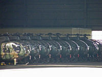 31163 @ RJAK - OH-6D/Kasumigaura (Heads a line of OH-6D's in the hangar) - by Ian Woodcock