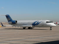 N155MW @ GYR - Nice new paintjob on Michael Waltrip's CRJ - by John Meneely