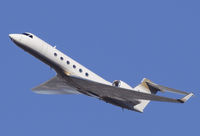 N721MM @ KSNA - Gulfstream G-V climbing into the blue sky. - by Mike Khansa